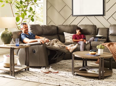 family resting on a la-z-boy reclining sectional sofa