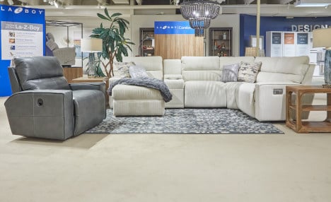 la-z-boy showroom with beige sectional and gray recliner