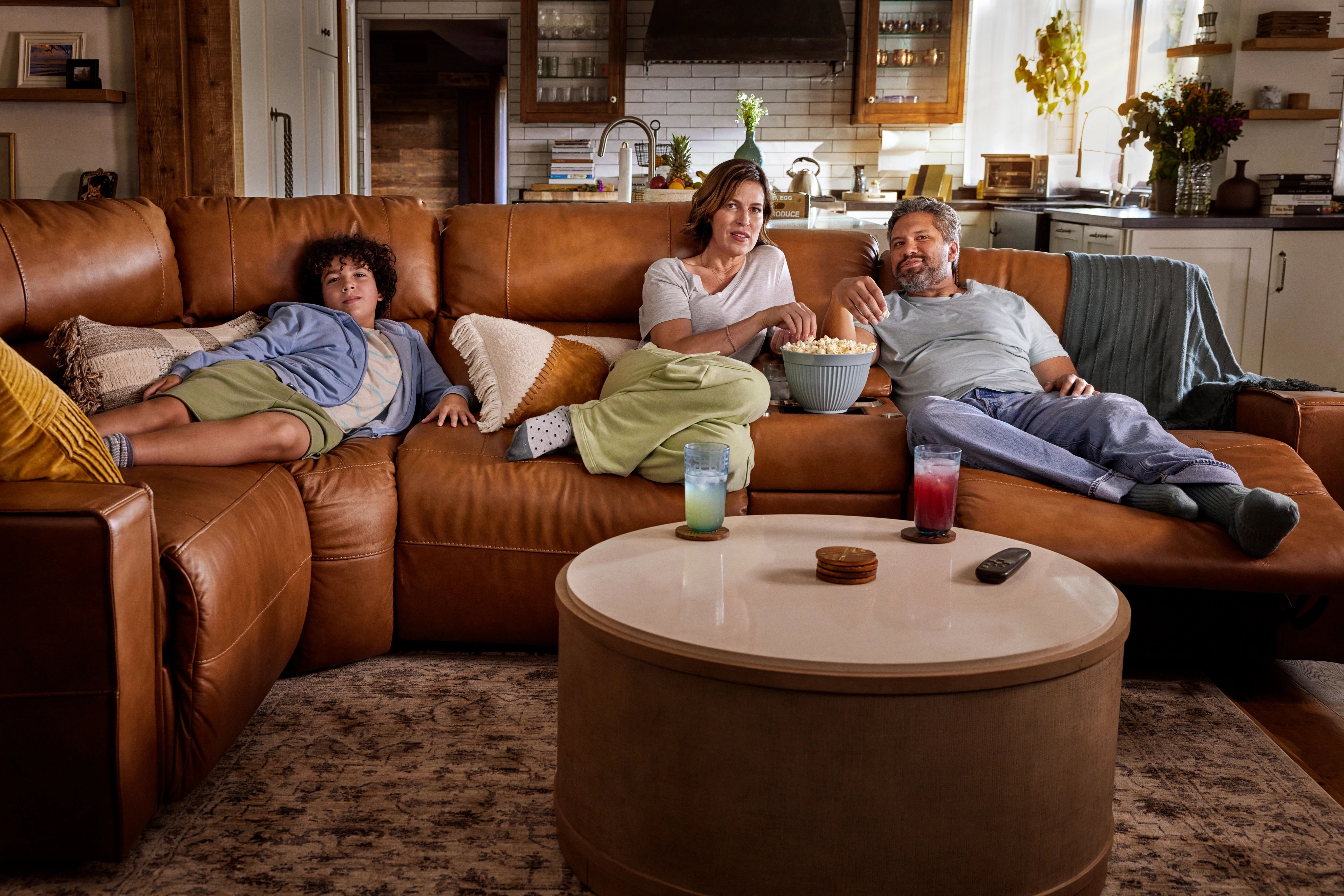 neutral tones with a brown leather sofa