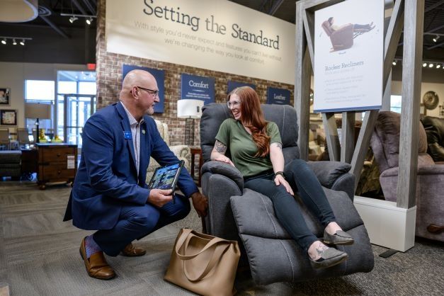 sales-manager-demonstrating-recliner
