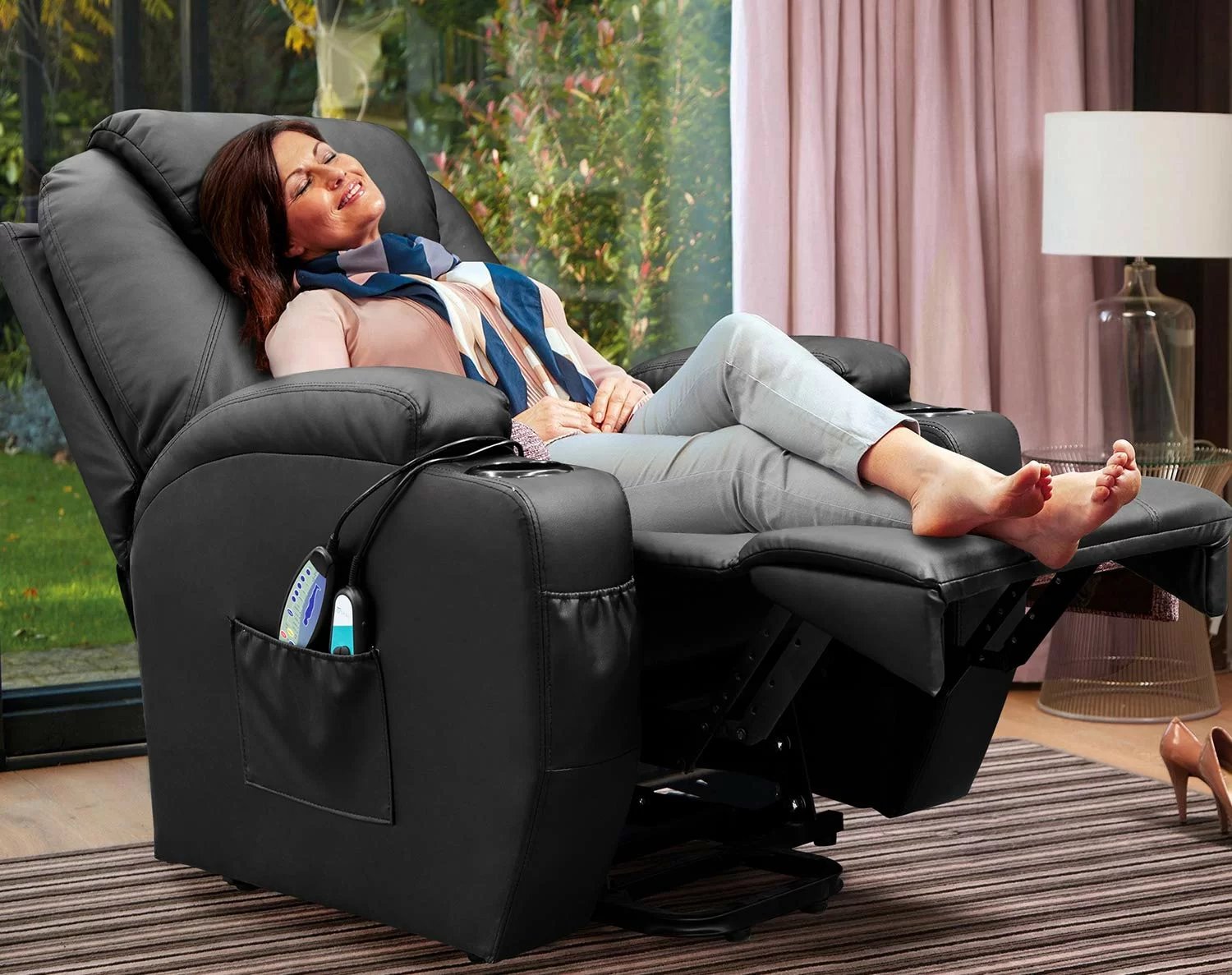woman relaxing in black leather power recliner chair
