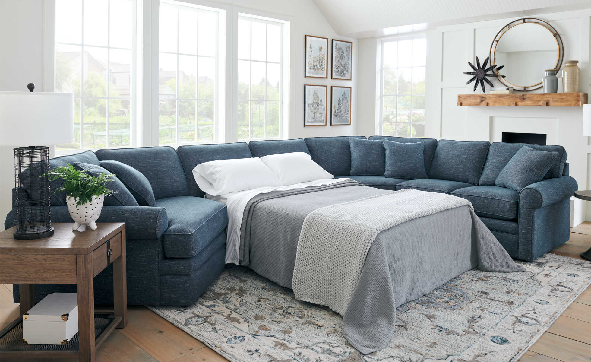 navy blue sectional sofa bed with bed pulled out in living room